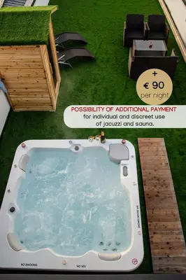 a jacuzzi tub in the middle of a yard at Roof Apartment ART-PE in Trebnje