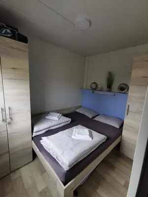 a bedroom with two beds in a room at Roof Apartment ART-PE in Trebnje