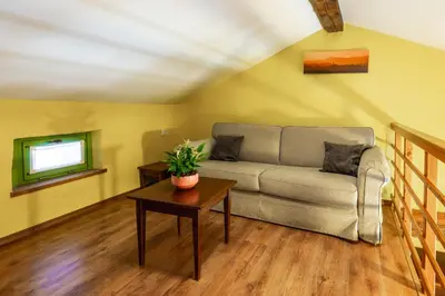 a living room with a couch and a table at House Marica in Šmartno