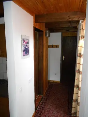 a hallway of a house with a door and a room at Apartments Balon in Kranjska Gora