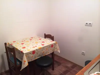 a table with a table cloth with flowers on it at Tourist Farm Šalamun in Banovci