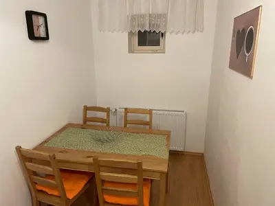 a dining room with a table and chairs at Martinov dom in Kranjska Gora