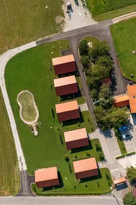 an overhead view of a building with a park at Martinova izba - Family Bungalows in Laško