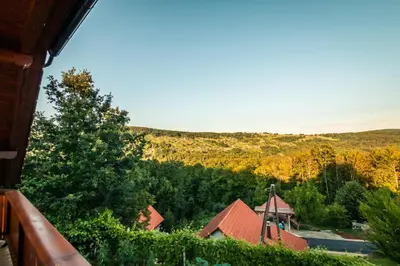 a view of a church from a porch of a house at Vineyard cottage Na hribu in Dvor