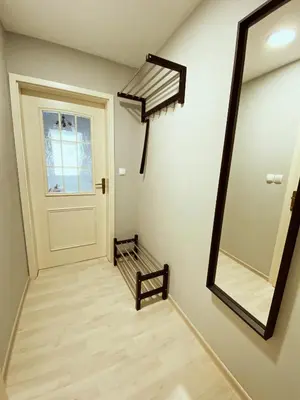 a hallway with a door and a mirror at Apartment 31 Vila Golf Nice Vacation in Rogaška Slatina