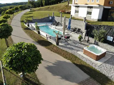 an overhead view of a swimming pool next to a house at Three Stars Luxury House ART-PE with pool and SPA pool in Trebnje
