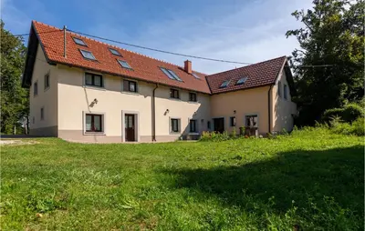 a large white house with a red roof at 3 Bedroom Pet Friendly Home In Col in Zoll