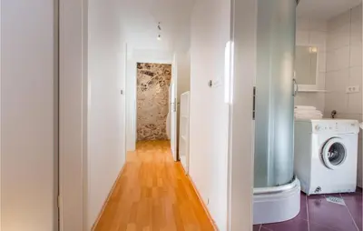 a bathroom with a washer and dryer in a room at 3 Bedroom Pet Friendly Home In Col in Zoll