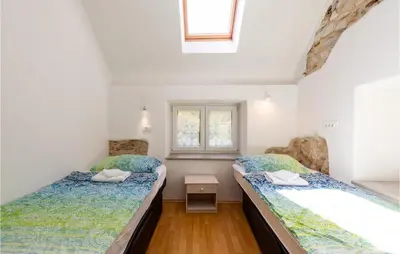 a bedroom with two beds and a window at 3 Bedroom Pet Friendly Home In Col in Zoll