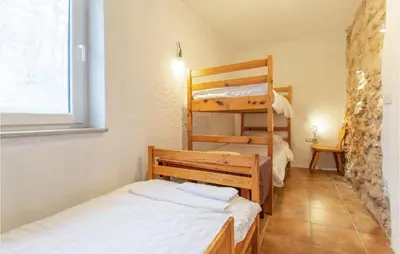 a small room with a bunk bed and a bunk bedwered at 3 Bedroom Pet Friendly Home In Col in Zoll