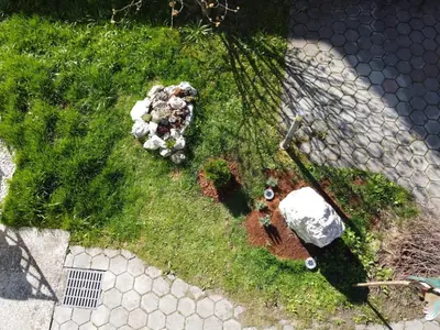 an overhead view of a garden with rocks and grass at Primula Apartment in Blejska Dobrava