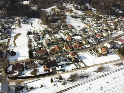 an aerial view of a town in the snow at Primula Apartment in Blejska Dobrava