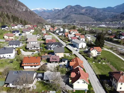 an aerial view of a small town in the mountains at Primula Apartment in Blejska Dobrava