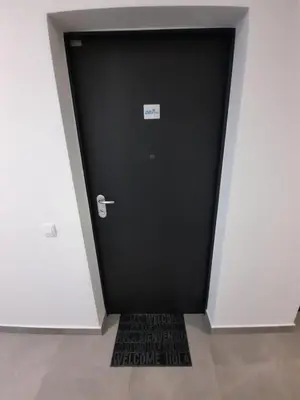 a black door with a sign on it in a room at DR7 Bled in Bled