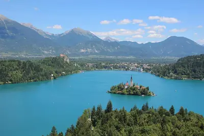 an island in the middle of a large lake at BledLake4U Apartment in Bled