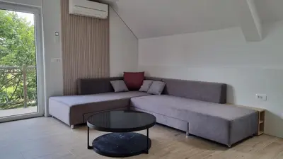a living room with a couch and a table at BledLake4U Apartment in Bled