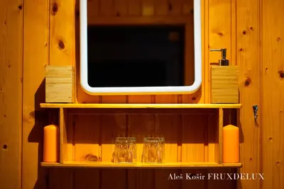 a shelf with glasses and a window on a wooden wall at Pet & Family Friendly House Viktorija - house near Golica with Triglav view in Jesenice