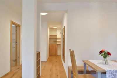 a dining room and kitchen with a table and chairs at Farm Stay Jarc Vineyard in Svečina