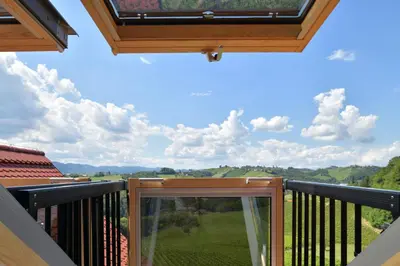 a balcony with a view of the countryside at Farm Stay Jarc Vineyard in Svečina