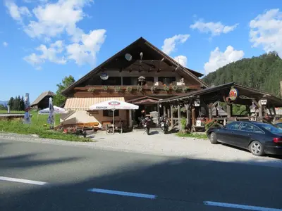 a building with a car parked in front of it at Bed&Breakfast Anž'k in Bled
