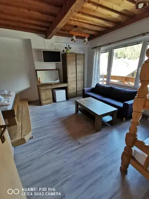 a living room with a couch and a table at Bed&Breakfast Anž'k in Bled