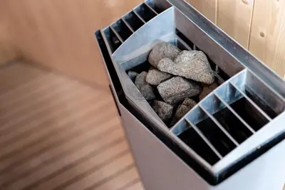 a bin full of rocks in a wall at Apartments Brina in Bohinj