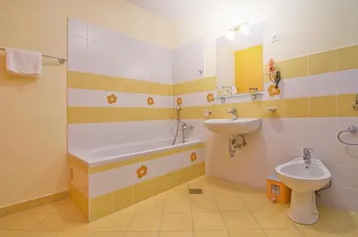 a bathroom with a sink and a tub and a toilet at B&B Na Kluk in Idrija