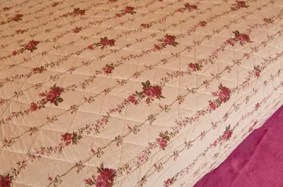 a close up of a quilt with flowers on it at B&B Na Kluk in Idrija