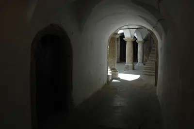 an empty hallway with stairs in an old building at Rooms and Apartment Na poljani in Škofja Loka