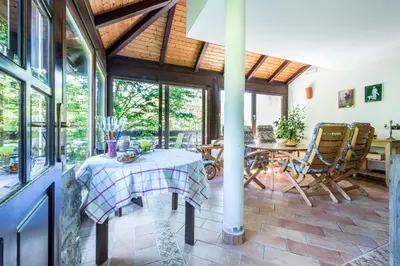 a dining room with a table and chairs at Apartments Jaka in Dolenjske Toplice