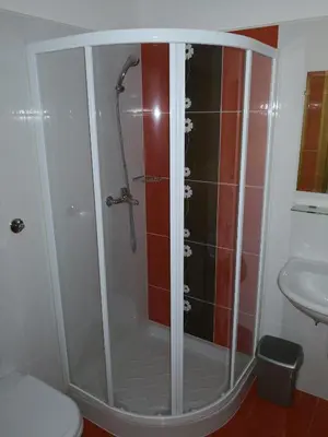 a shower in a bathroom with a toilet and a sink at Gostilna pri Dragici, gostilna s prenočišči, d.o.o. in Sežana