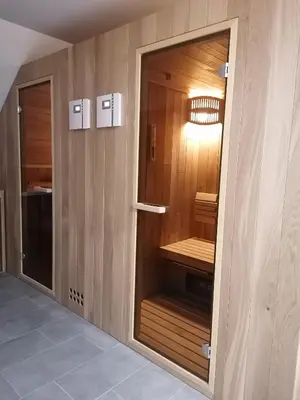 a walk in closet with a glass door at Apartments Gorski raj in Kranjska Gora