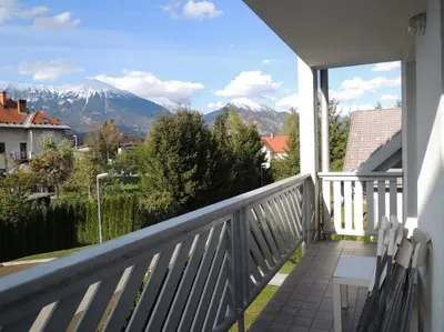a balcony with a view of a mountain at Marvellous Face in Bled