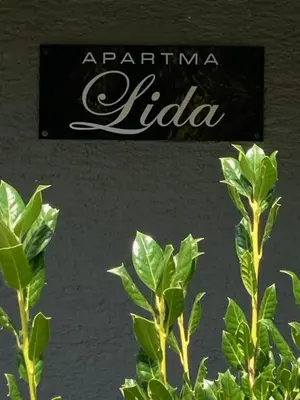 a sign that says argentina liliana next to a plant at Apartment Lida in Podčetrtek