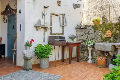 a room with a sink and a mirror on a wall at Apartma Hiša Pliska in Pliskovica