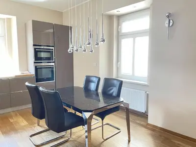 a dining room table and chairs in a kitchen at Apartment Ljubljana in Ljubljana