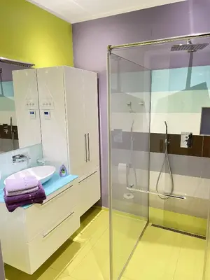 a bathroom with a glass shower and a sink at Apartment Ljubljana in Ljubljana