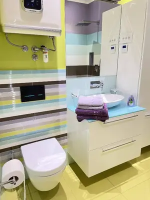 a bathroom with a white toilet and a sink at Apartment Ljubljana in Ljubljana