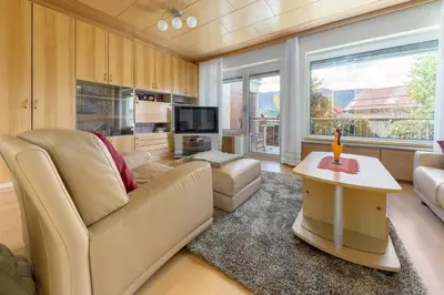a living room with a couch and a table at Apartment Franko in Radovljica