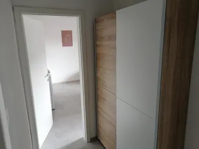 a door leading into a room with a hallway at Apartments Rosemary Ljubljana & Free Parking in Ljubljana