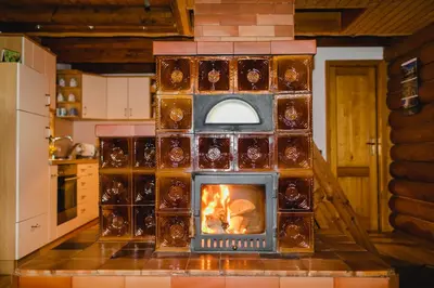 a model of a kitchen with a fireplace at Wood house Irena-Počitniška hiša in Bohinj