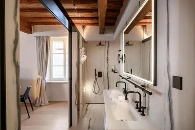 a bathroom with a sink and a mirror at Zlata Ladjica Boutique Hotel in Ljubljana