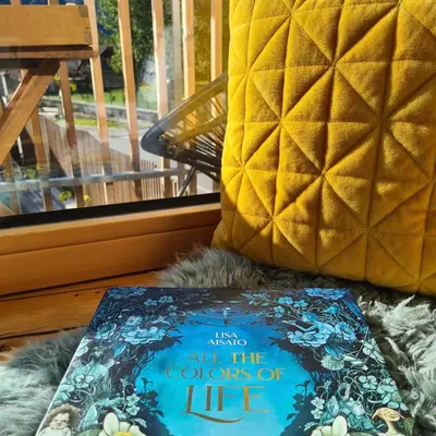 a book sitting on top of a pile of fur at Emerald Valley Apartments in Bovec