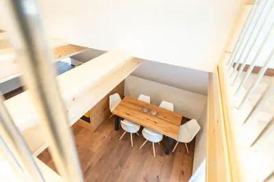 an overhead view of a dining room with a table and chairs at HIŠA KOSOBRIN in Kranjska Gora