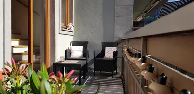 a row of chairs in a room with plants at 7 LAKES apartment in Bohinj