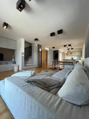 a large bed in a large room with a kitchen at Villa Recica North in Bled