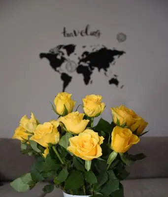 a bouquet of yellow roses in a vase at M&M Apartment in Zgornje Gorje