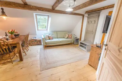 a living room with a couch and a table at Apartment DOMI in Soča