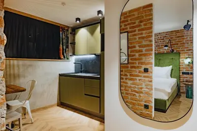 a room with a bed and a mirror at ONE66 Hotel in Ljubljana