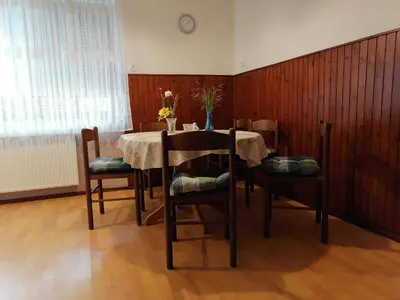 a dining room with a table and some chairs at Bela golobica Bogojina in Bogojina